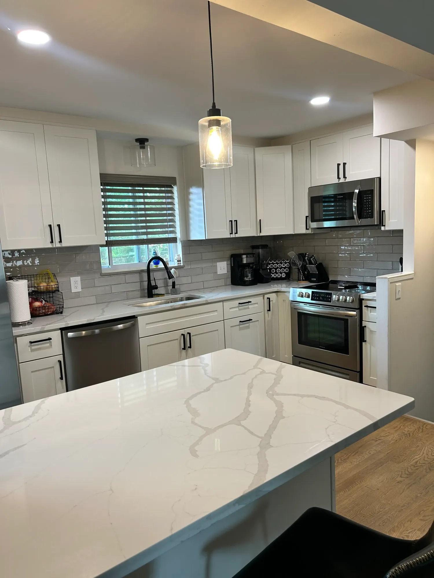 Spotless move-in-ready kitchen with a quartz island and stainless appliances in Cincinnati